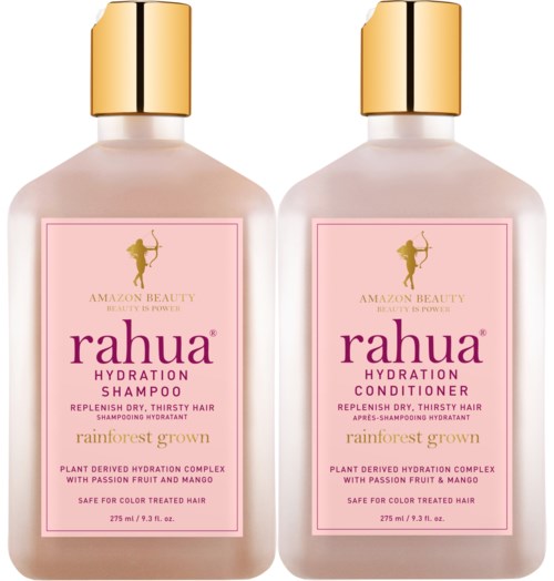 Two bottles of Rahua hydration hair products, one shampoo and one conditioner, with gold caps and pink labels.