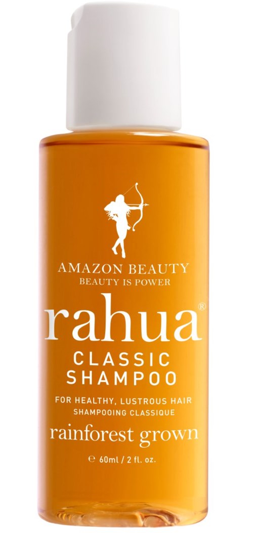 A small orange bottle of Rahua Classic Shampoo with a white cap. It has text and a figure of an archer.