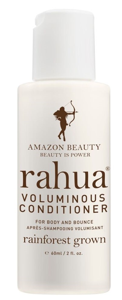 A white bottle of Rahua volumizing conditioner with a cap, labeled for rainforest-grown ingredients, for body and bounce.