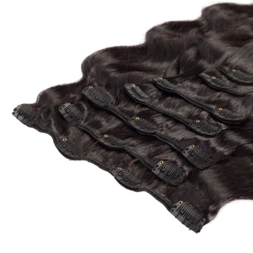 Multiple black hair extensions with clips, ready to be attached for added length and volume.