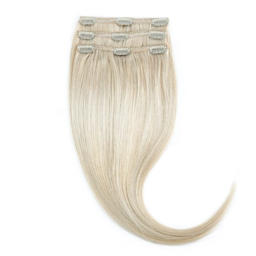 Four blonde hair extensions with clips, shiny and smooth, are shown in a vertical layout.