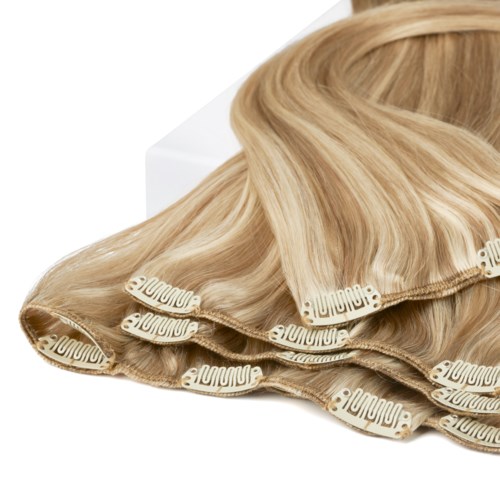 Blonde hair extensions with clips for styling or adding length.