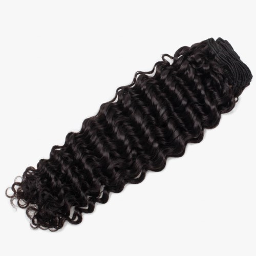 A bundle of black, tight, curly hair extensions or weaves with an elastic band at one end.