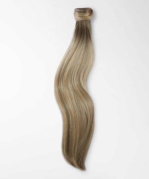 A strand of long, wavy, blond hair with darker and lighter shades.