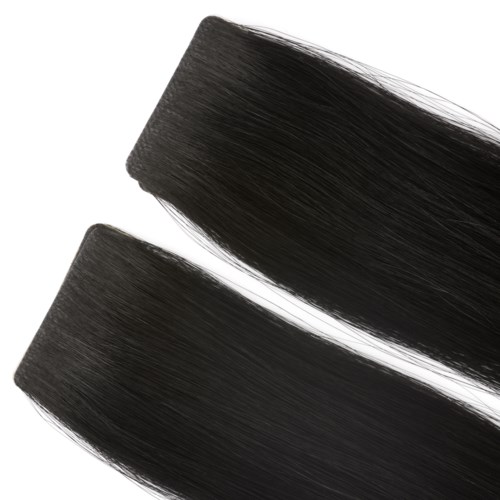 Two black hair extensions or strands are neatly aligned and slightly curved.
