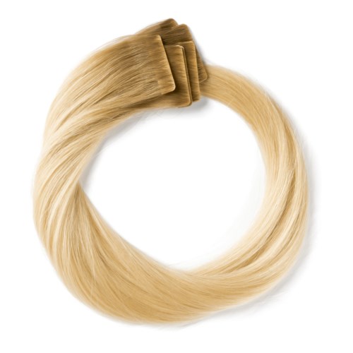 Blonde hårförlängning eller perukloop med klämmor.