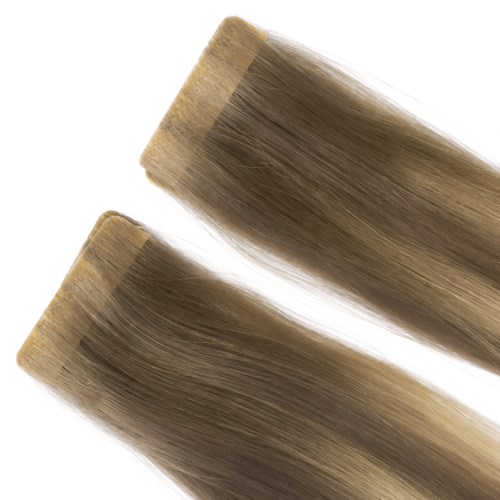 Two hair extensions or pieces of hair, light brown with a smooth texture and blunt cut ends.