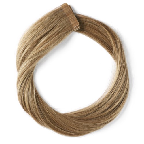 En slinga av blonda hårförlängningar med klämma upptill för att fästa i håret.