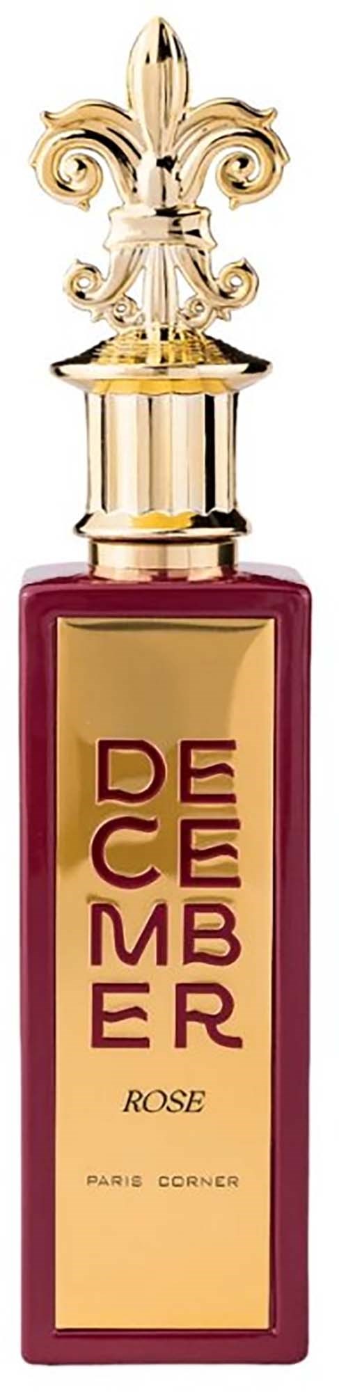 A perfume bottle with a gold decorative cap and a pinkish-red body, labeled "Decembre Rose".