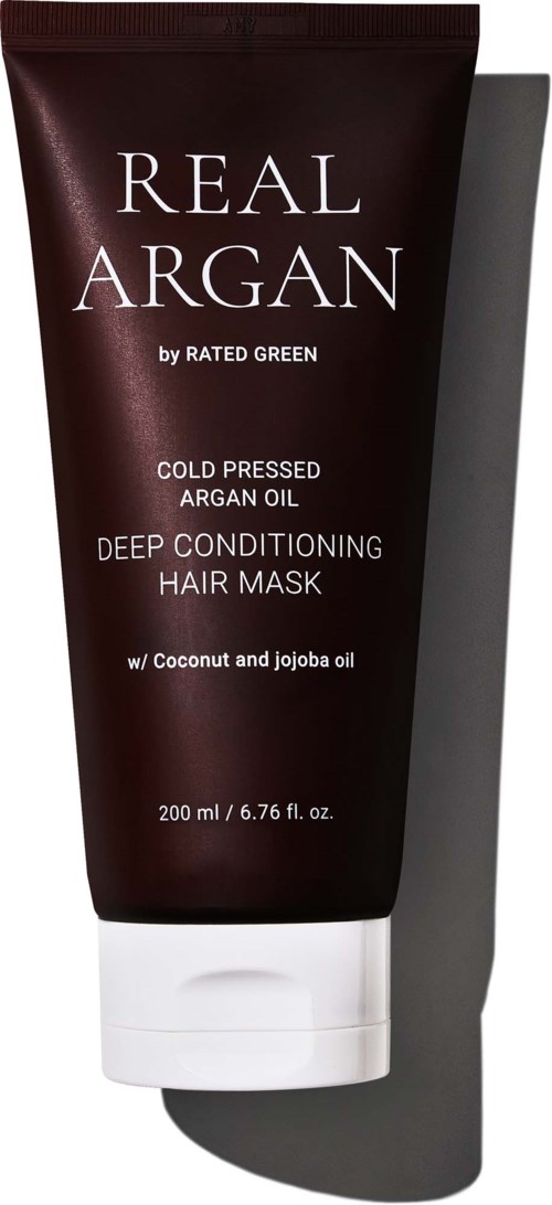 Tummansininen putkilauta, jossa valkoinen korkki ja teksti Real Argan, sisältää kookos- ja jojobaöljyä.