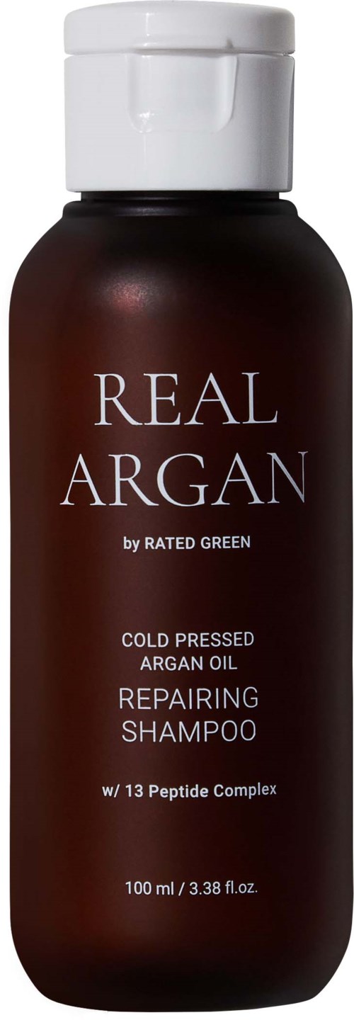 Een fles herstellende shampoo met arganolie, bevat 100 ml, van Rated Green, met witte dop.