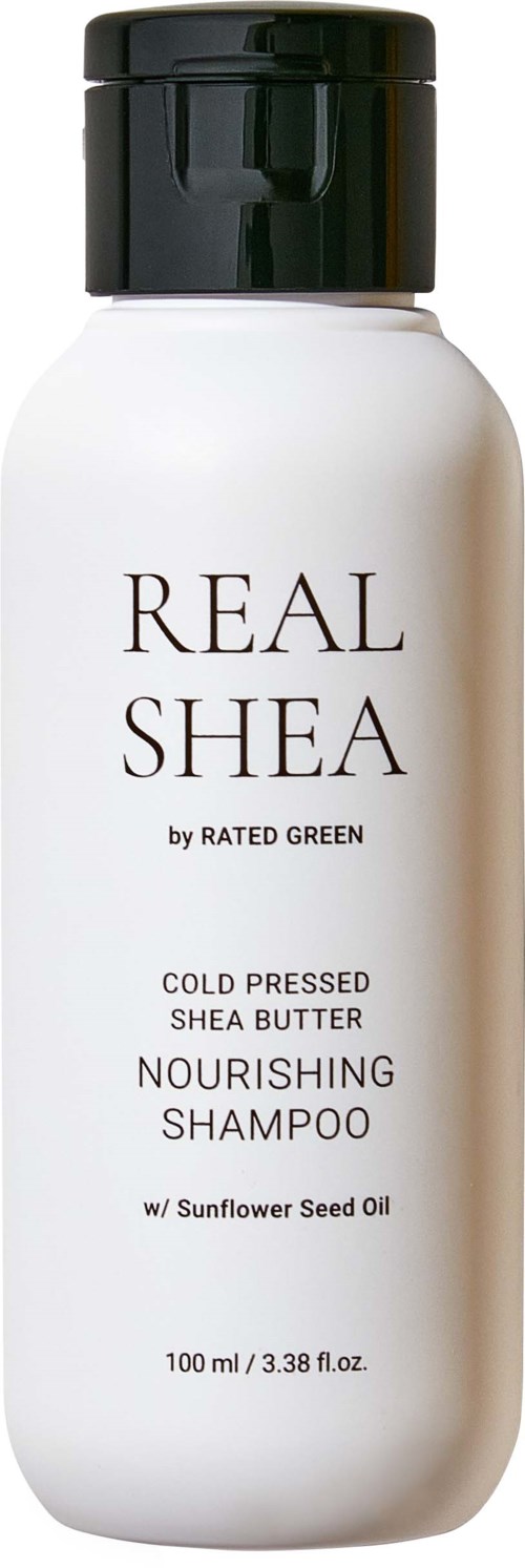 Een witte fles met voedende shampoo met zwarte dop, gelabeld Real Shea met sheaboter en zonnebloemzaadolie.