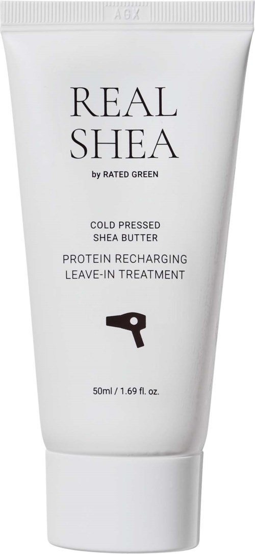 A white tube labeled 'Real Shea' with black text and a small black icon of a hairdryer, containing shea butter product.