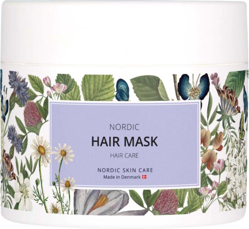 A white container with a floral design and a purple label for Nordic hair mask.