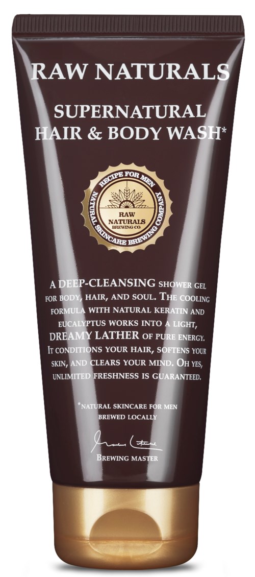 A brown tube of RAW Naturals Supernatural Hair & Body Wash with gold cap and label text.