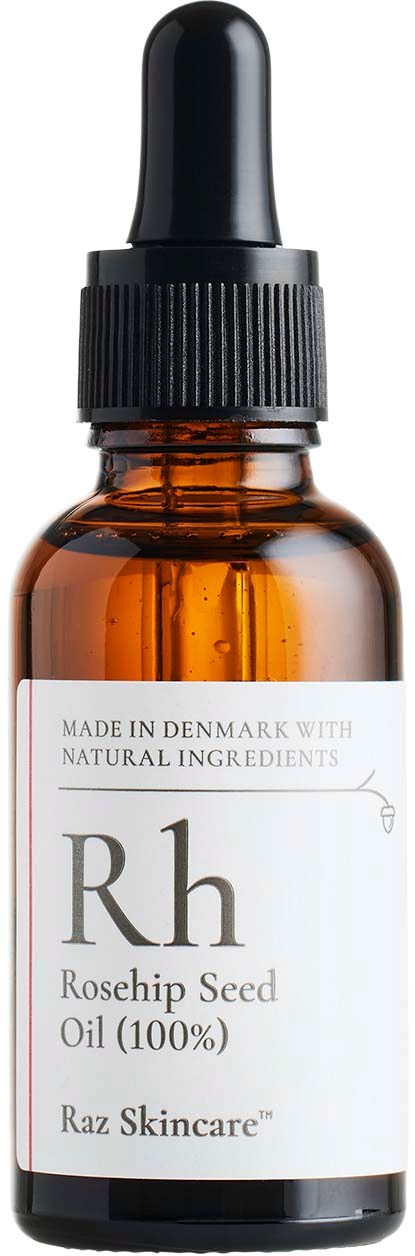En bärnstensfärgad glasflaska med svart tipp, etiketten visar Rosehip Seed Oil från Raz Skincare.