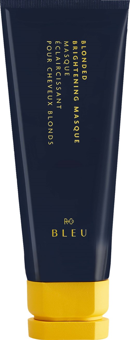A dark blue tube with yellow cap, labeled as a nourishing mask with clay and acids for eyelashes and eyebrows.
