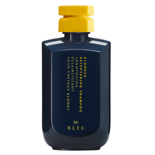 Eine dunkelblaue Flasche mit gelbem Deckel, gekennzeichnet als Bonding-Shampoo mit Kamille und Blüten. Die Marke ist BLEU.