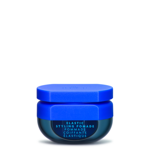 Ein kleiner Behälter mit blauer elastischer Stylingpomade mit passendem Deckel und Etikett.