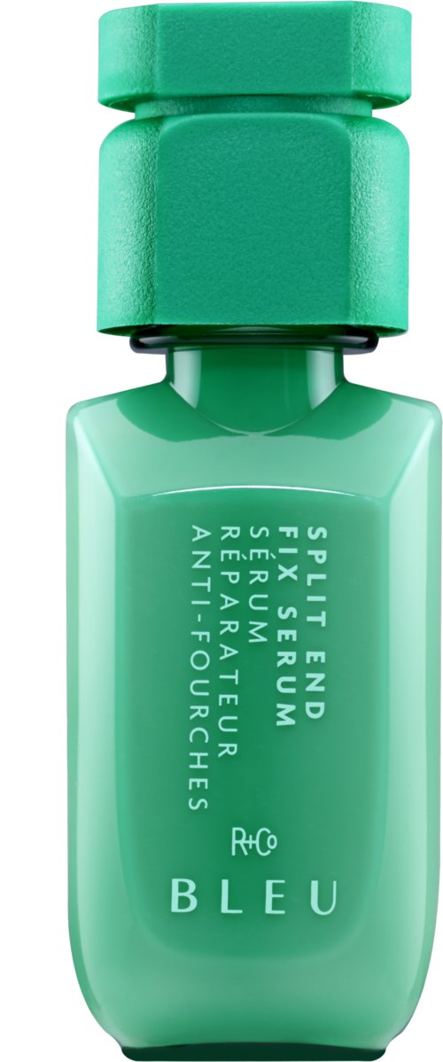 Eine kleine grüne Flasche mit passendem Deckel, beschriftet mit weißen Text, vermutlich Kosmetik- oder Hautpflegeprodukt.