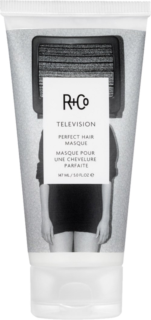 Eine Tube mit Perfect Hair Maske von R+Co, mit einem Schwarz-Weiß-Bild einer Frau und Produktdetails.