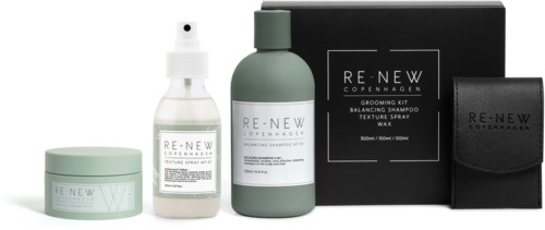 Eine Reihe von Haarpflegeprodukten, darunter ein Becher, Sprayflasche, Shampoo und eine schwarze Tasche, in einem eleganten Design.