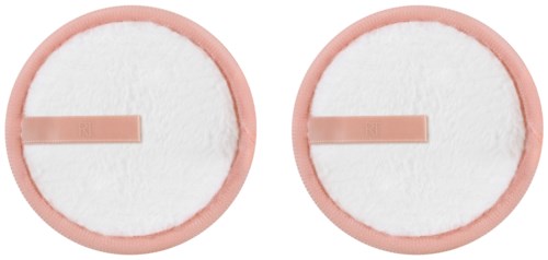Two round white cotton pads with pink edges and small rectangular sticks in the center.