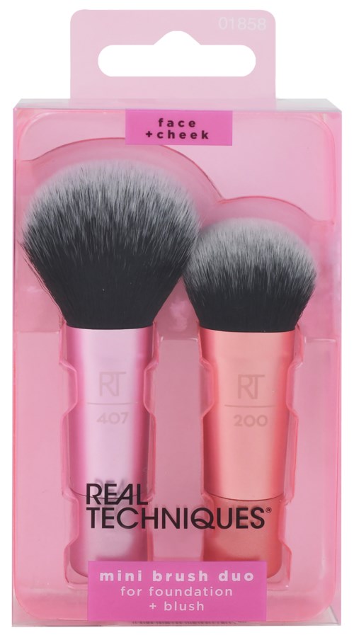 Pink packaging for a set of two makeup brushes labeled 'face + cheek' for foundation and blush.