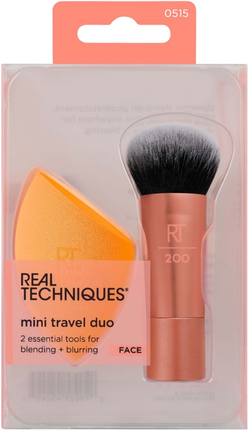 A compact makeup brush set with a sponge, designed for blending and applying foundation during travel.