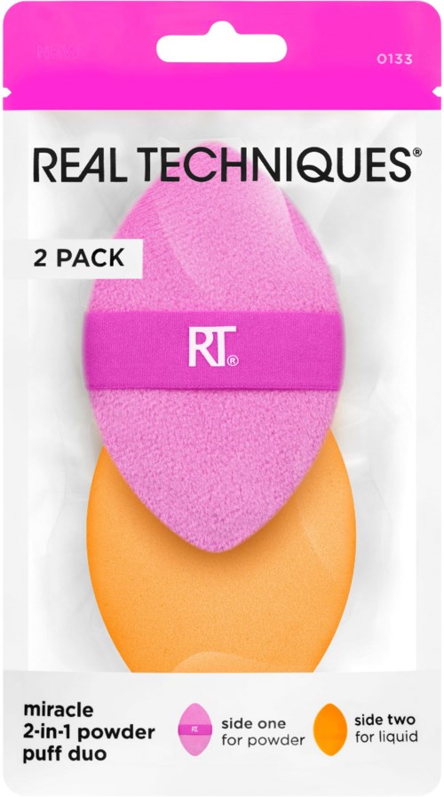 Two makeup sponges, one pink and one orange, in packaging labeled 'REAL TECHNIQUES' and 'miracle 2-in-1 powder puff duo.'