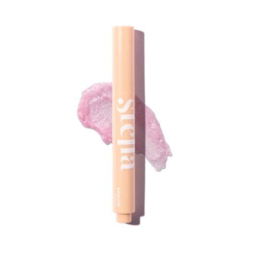 A beige lipstick with the word 'Suavia' written on it, resting on a pink, textured makeup sponge.
