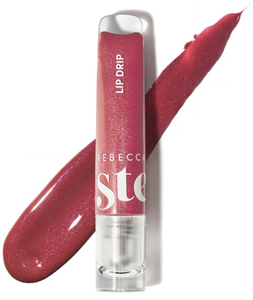 Lip gloss tube with pink shade and a swatch behind it. The label says "Rebbecca Ste" and "Lip Drip."