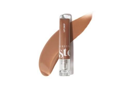 A brown liquid lipstick with a transparent cap and applicator, labeled 'Stay' and 'Lip Balm'.