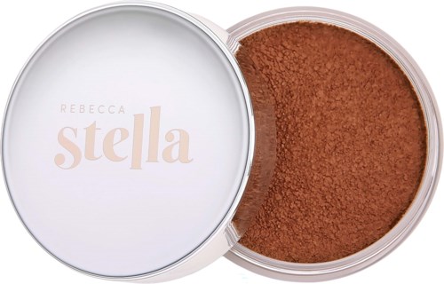A round container with brown powder, with a lid showing "Rebecca Stella" in beige and light pink.