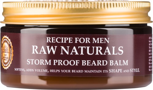 A jar of beard balm labeled 'Raw Naturals', with a gold lid, designed for men to soften and style beards.