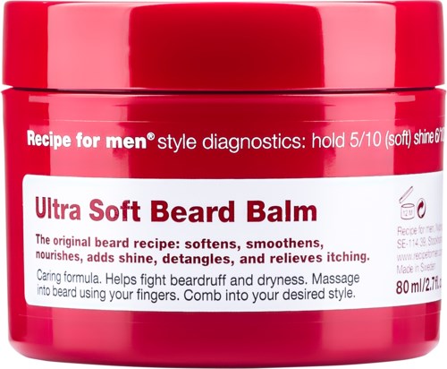 A red jar of Ultra Soft Beard Balm, with white and red label describing its use for soothing and styling beards.