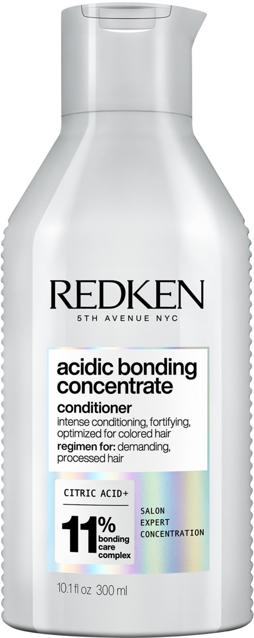 Een witte fles Redken acid bonding concentrate conditioner voor gekleurd haar, bevat 300 ml, met een label dat citroenzuur en binding benadrukt.