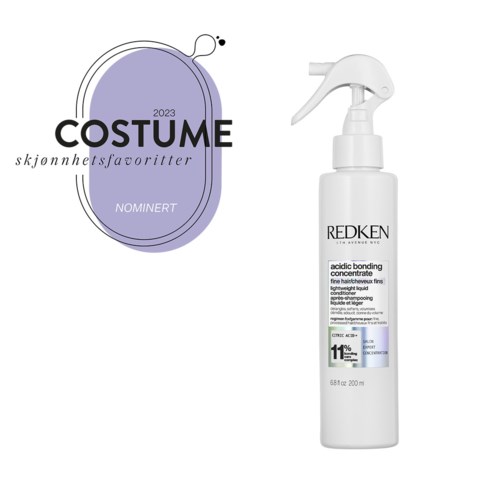 En logotyp för kostympriser på en lila form, bredvid en vit sprayflaska med Redken hårprodukt.