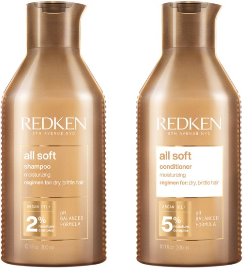 Twee gouden flessen van Redken haarverzorgingsproducten, één voor shampoo en één voor conditioner, met vergelijkbaar ontwerp en labels.