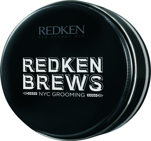 Een ronde zwarte container met de woorden 'REDDEN BREWS' in vet wit en 'NYC GROOMING' eronder.