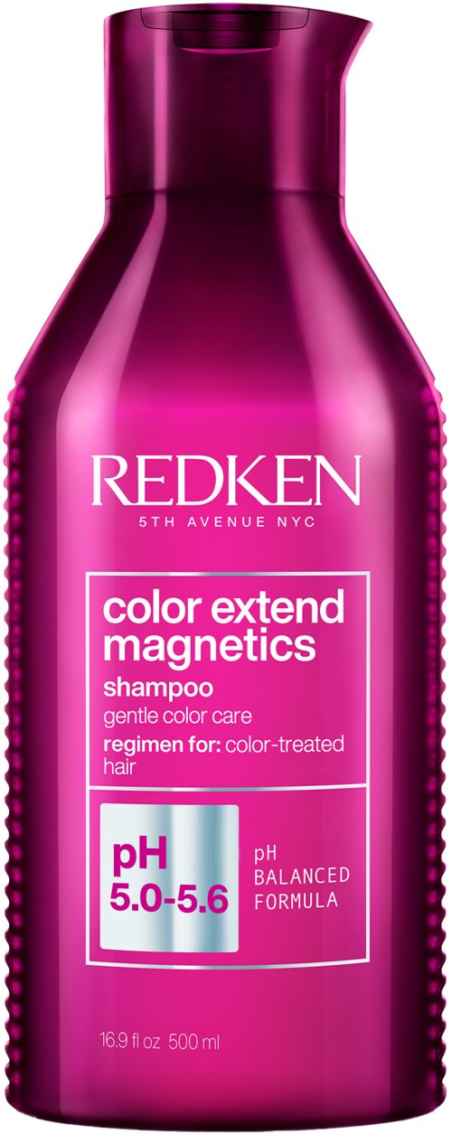 En magentafärgad flaska med Redken-schampo, märkt för färgbehandlat hår, pH 5,0-5,6, 16,9 fl oz.