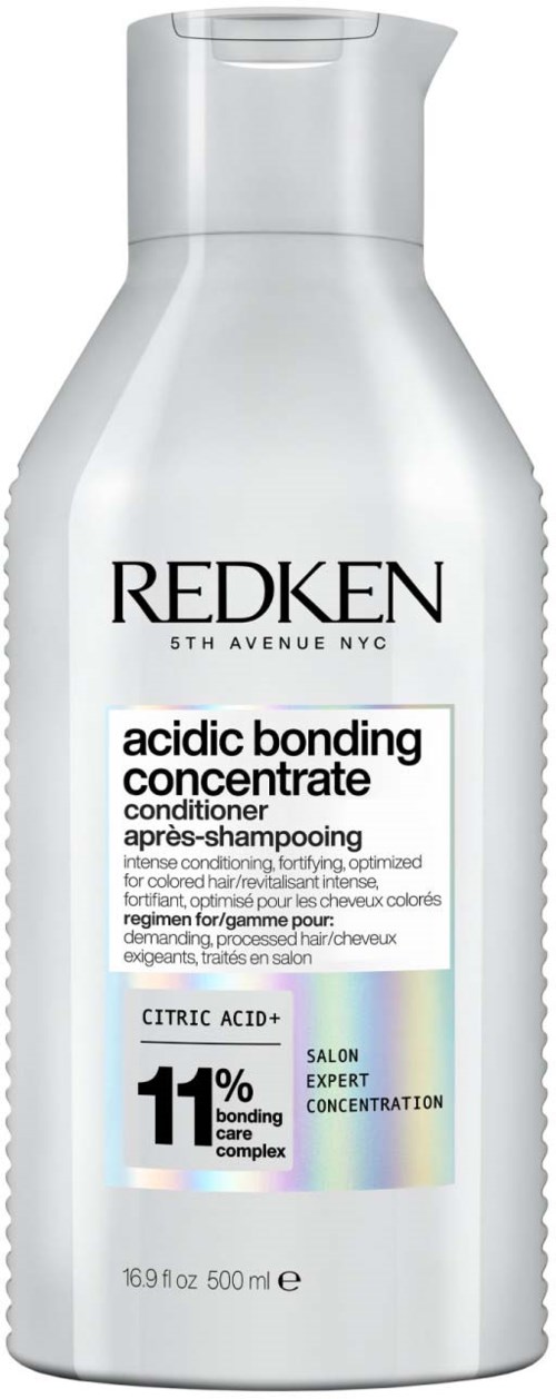 Redken conditionerfles met productnaam en percentage van bondingcomplex. Wit en zilver ontwerp.