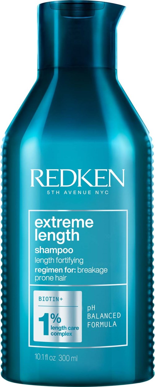 Blauwe fles van Redken Extreme Length shampoo voor breekhaar, pH gebalanceerde formule met biotine.