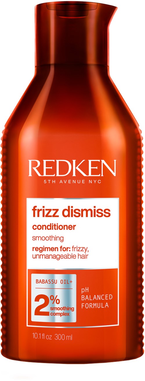 Redken-conditionerfles met witte en oranje label, met tekst 'frizz dismissal' en 'smoothing.'