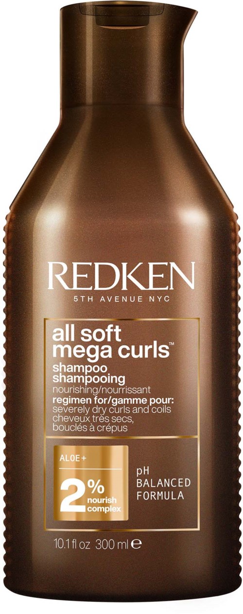 Redken-schampoflaska i brunt med vit och guld text, nämner 'mega curls' och 'aloe'.