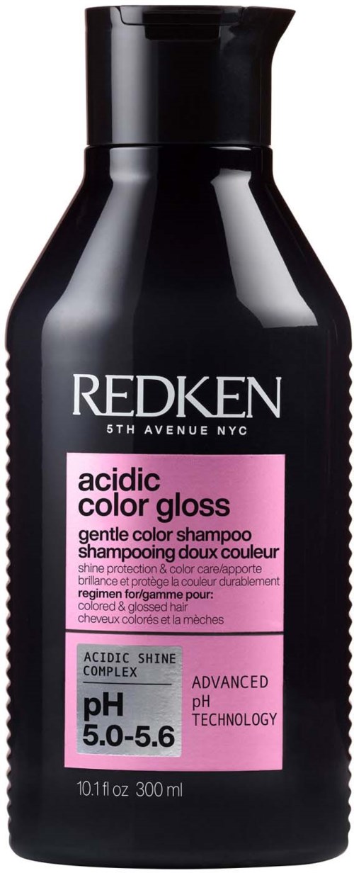 Zwarte fles Redken zure kleur glans shampoo met roze label en witte tekst.