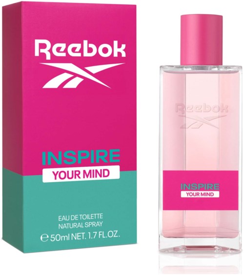 Roze en turquoise Reebok Inspire Your Mind parfumdoos en fles getoond.