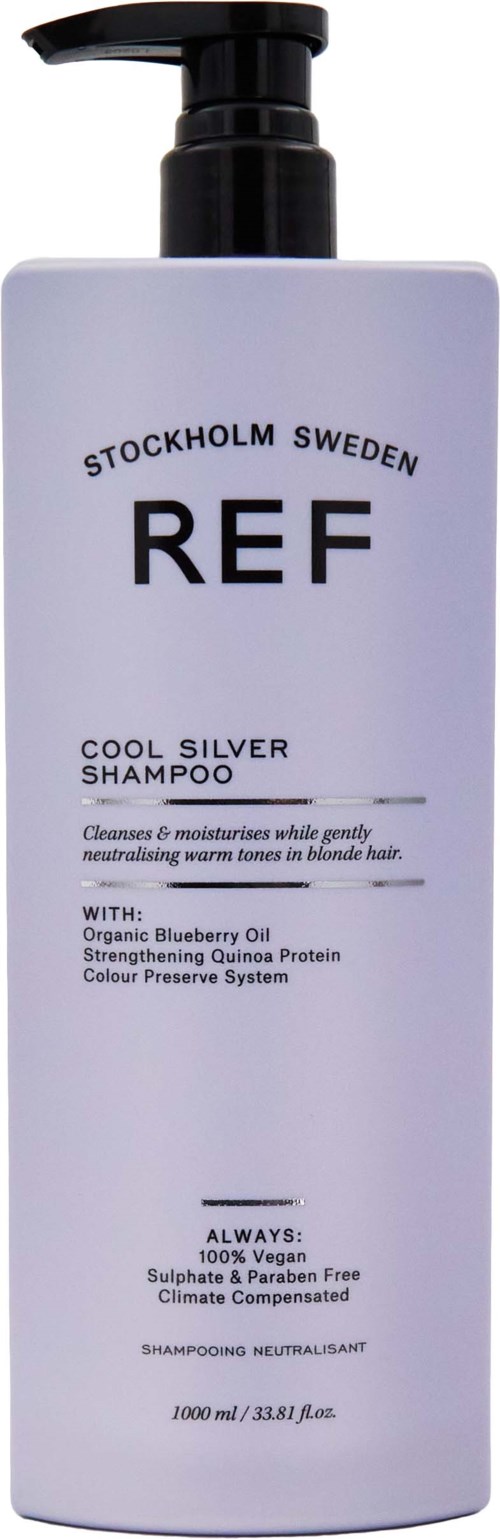A white shampoo bottle with a black pump, labeled 'REF COOL SILVER SHAMPOO' from Stockholm, Sweden, with blueberry oil.