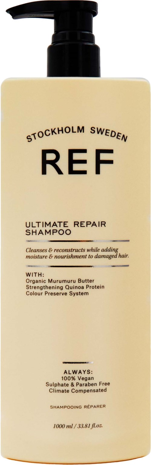 Eine weiße Flasche mit schwarzem Pumpverschluss, beschriftet mit 'REF Stockholm Sweden Ultimate Repair Shampoo' für Haarkur.