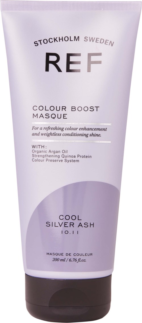 Eine Tube mit lila und schwarzer Farbe, beschriftet mit Produktname, Beschreibung und Inhaltsstoffen für Haarpflege.
